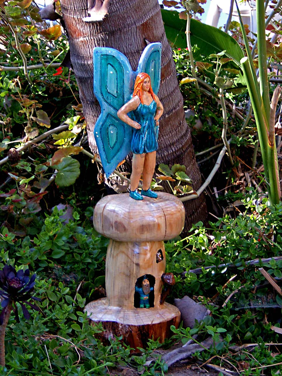 Wood carving of a fairy, sculpture of a fairy, art